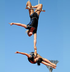 Rowan is the base, Laura is the flier,in doubles trapeze for Gravity and Other Myths 