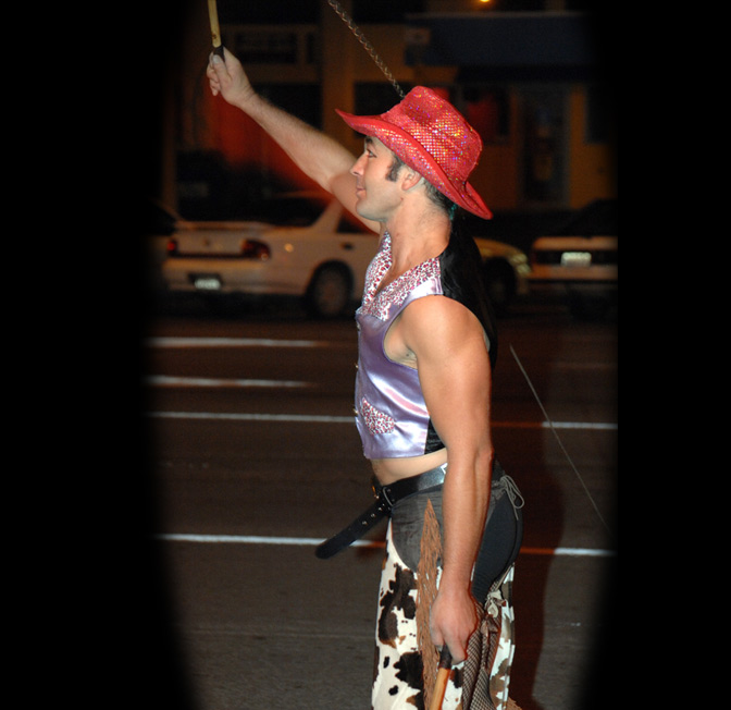 Tom Beauchamp cracks the whips as part of the pre-show roving for Heavenly Burlesque. 