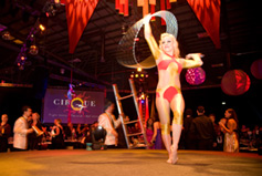 Laura spins a sparkling hula hoop at a corporate function. 