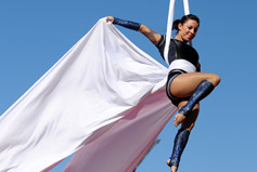 Laura Hudson on a white Tissu in Gravity and Other Myths. 