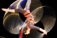 Magenta Diamond spins her hoops in mid air. 